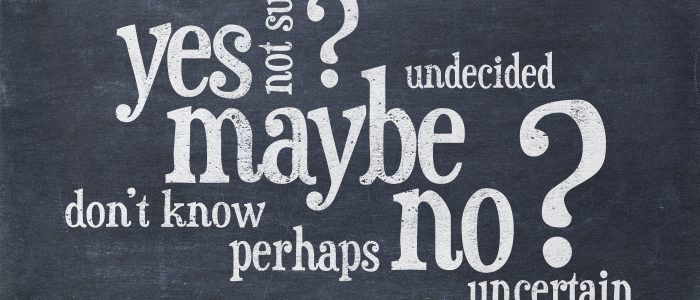 undecided or uncertain concept - yes, no, maybe word cloud on a vintage blackboard