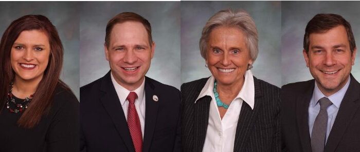 Four smiling professional headshots