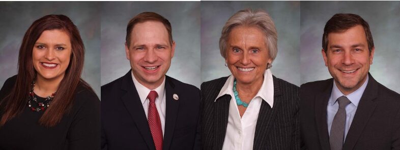 Four smiling professional headshots