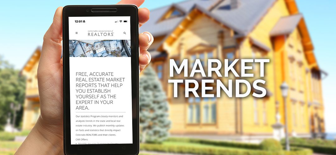 Smartphone displaying real estate market trends.